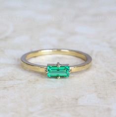 Exclusive to Benati This ring holding a beautiful baguette cut lab emerald size 6x3 mm approx. 0.40 carat. Ring width is approx. : 2mm. Available also with a natural diamond / sapphire / emerald, or any other gemstone - send me a message for a quote. * Sent with Express shipping (approx. 2-4 business days!) with tracking number to your door * Sent with very elegant engagement ring box * Brand new - Made to order - Please allow approx. 14 business days to craft. * If you need the ring by a specif Green Birthstone Ring, Fine Jewelry, Gold Emerald-cut Birthstone Ring With Gemstone, Green Emerald Ring For May Birthstone, Dainty Style, Green Baguette-cut Emerald Ring In 14k Gold, Green 14k Gold Emerald-cut Rings, Printable Ring Sizer, Baguette Ring, Elegant Engagement Rings, Emerald Cut Rings