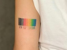 a barcode tattoo with the number twenty nine on it's left upper arm