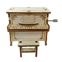 an old fashioned piano is sitting on a stool