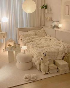 a bed with white sheets and pillows on top of it in a room filled with furniture