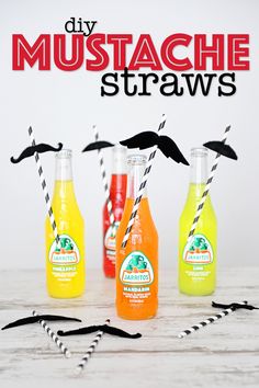 three bottles with straws and two moustache straws in them on a table