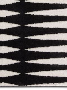 a black and white rug with horizontal stripes