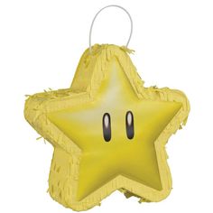 a yellow star shaped pinata with two eyes on it's face, hanging from a string