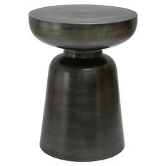 a metal stool with a round top on a white background