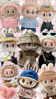 many different stuffed animals wearing hats and clothes