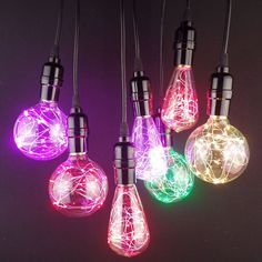 multicolored light bulbs hanging from wires on a black background with the words lyghtlight above them