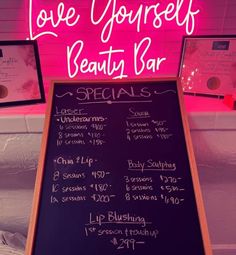 a sign that says love yourself beauty bar