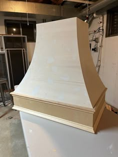 a large white stove top sitting inside of a kitchen