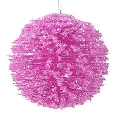 a pink ball ornament hanging from a string