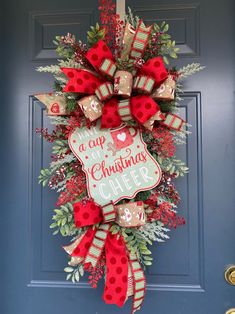 a christmas wreath hanging on the front door