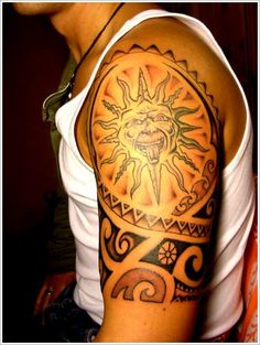 a man with a tattoo on his arm that has an image of a sun in the middle