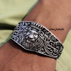 King Lion Cuff Bangle, Solid 925 Sterling Silver Bangle, Adjustable Bangle, Handmade Bangle, Wild Animal Bracelet, Lion Head Bracelet, Gift  All my Designs are original. King Lion Bangle This Bangle is for Women & Men You will receive a Bangle like the one in the pictures This Bangle have 925 Stamp Suitable for use in everyday situations, or can also be used as a gift. Unique design will make a special attraction for the wearer. I make my jewelry with passion and love. The perfect gift for a Special occasion Wholesale Orders Accept on Wholesale Price All Pieces Have 925 Stamp Lion Head Bracelet, Animal Bracelet, King Lion, Sterling Silver Bangle, Handmade Bangles, Adjustable Bangle, Sterling Silver Bangles, Silver Bangle, Lion Head