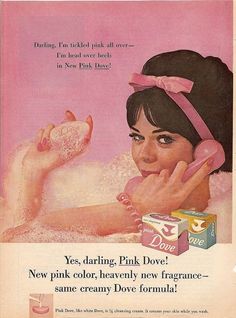 an advertisement for dove's soap with a woman holding a box of pink powder