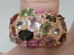 Vintage  Genuine Multi-color Tourmaline Cluster Ring in Sterling Silver with Yellow Gold Vermeil.    Ring is a US SIZE 8.25.    Genuine Tourmaline gemstones measure from a 1.5mm round, up to 5mm x 3mm oval. 24 stones total .   Top of ring measures 15.3m) wide x 3mm at bottom center of shank.   Marked 925 with  as shown last in photo.    Ring weighs 6.7 grams.   In very good pre-owned condition. US SIZE 8.25 Multicolor Tourmaline Ring Jewelry, Multicolor Tourmaline Gemstones Fine Jewelry, Multicolor Tourmaline Gemstones For Fine Jewelry, Multicolor Tourmaline Jewelry For Anniversary, Multicolor Tourmaline Fine Jewelry, Multi-stone Tourmaline Gemstones For Anniversary, Multicolor Tourmaline Rings For Anniversary, Multicolor Tourmaline Rings With Gemstone Accents, Multicolor Tourmaline Rings With Accent Stones