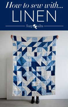 a woman holding up a blue and white quilt with the words how to sew with linen