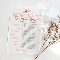 a pink bachelorette scavenger hunt printable on a white background with dried flowers