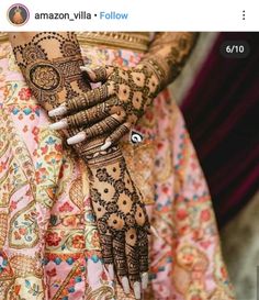 a woman with henna on her hands