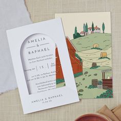 the wedding stationery is laid out on top of a table with an open envelope