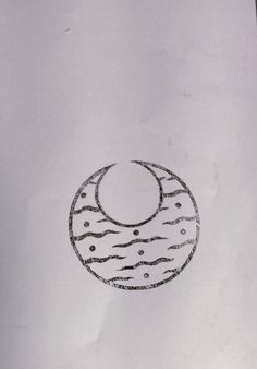 a drawing of a doughnut with the moon in it's center, on top of a piece of paper