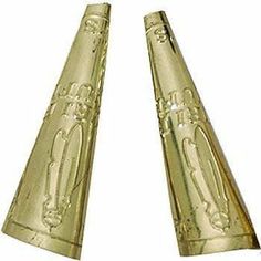 two gold colored cones with designs on them