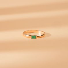 Annie Simplicity and elegance go hand in hand. This May Birthstone ring has a dome band featuring a stunning natural baguette emerald in the middle and is perfect for stacking. Wear this ring for yourself or gift it to someone you love. - Handmade- Solid Gold- Natural Emerald- The Width of the Band: 2 mm- The Height of the Setting: 1.8 mm- Total Emerald Carat Weight: 0.13 ctw All pieces come beautifully boxed in suede pouches you can always use when traveling! Emerald Band, May Birthstone Rings, Birthstone Rings, Peridot Jewelry, Dome Ring, May Birthstone, Birthstone Gifts, Domed Ring, Emerald Jewelry