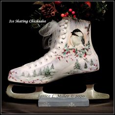 an ice skate decorated with a bird on it