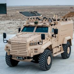 an armored vehicle is parked in the desert