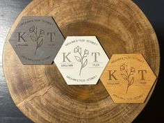 three wooden hexagonal coasters with the initials kt and t on them