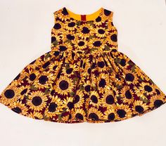 girls sunflower dress, maroon dress, family pictures dress, toddler flower dress, sunflower print dress, girl nature dress, girl sundress Beautiful, bold sunflowers adorn this dress for the flower lover who picks it. Fabric does not provide stretch Washing instructions: wash in cold water and air dry or dry on delicate Family Pictures Dress, Harvest Dress, Girls Fall Dresses, Mustard Yellow Dresses, Girls Spring Dresses, Fox Dress, Pumpkin Dress, Thanksgiving Dress, Girls Thanksgiving