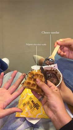 two people eating waffles and ice cream from a wrapper with the words choco sundae above them