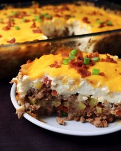 a casserole dish with meat and vegetables on it, ready to be eaten