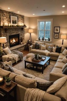 a living room filled with furniture and a fire place in the middle of the room