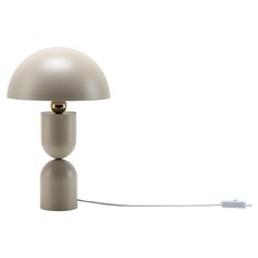 a white table lamp sitting on top of a desk