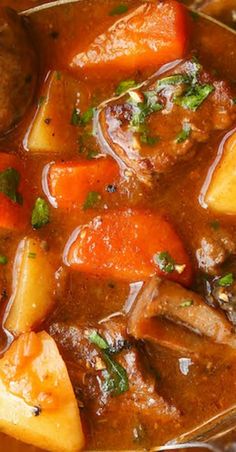 a stew with carrots, potatoes and meat