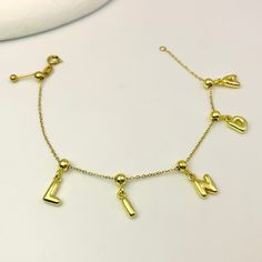 Get personal with the Minimalist Bubble Initial Bracelet! Make a statement with this sleek, gold charm bracelet adorned with bubble-style letters of your choice. The adjustable clasp guarantees a perfect fit for any wrist, so you can rock your initials or name in style. Perfect for adding a touch of individuality to your minimalist look. Latina Culture, Initial Bracelet Gold, Style Letters, Bubble Style, Gold Charm Bracelet, Initial Bracelet, Custom Earrings, The Minimalist, Custom Bracelets