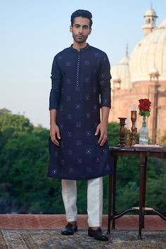 Deep navy blue cotton silk kurta with floral and mirror embroidered motifs. - Aza Fashions Indigo Cutdana Kurta For Eid, Indigo Kurta With Zari Work For Diwali, Indigo Cotton Silk Kurta For Eid, Indigo Kurta With Chikankari Embroidery For Festivals, Indigo Chanderi Kurta For Festivals, Designer Indigo Cotton Kurta, Designer Cotton Kurta In Indigo, Indigo Traditional Wear With Chikankari Embroidery For Diwali, Festive Indigo Traditional Wear With Chikankari Embroidery