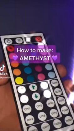 a person holding a remote control with the words how to make amethyst on it