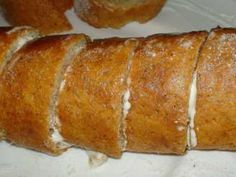 a long loaf of bread sitting on top of a table