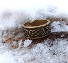 a ring sitting on top of snow covered ground