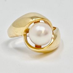 14K Gold Ring with 8mm Cultured Pearl Designer = Jewelry Size = 6.75 Material = 14K Gold Gemstone = Pearl Condition = Very Good Class = Premier Location: Glencoe Item Number: 11405-1400 Item ID: 288932 Category: Ring Modern Round Pearl Ring In Yellow Gold, Classic 14k Gold Pearl Ring Hallmarked, Classic 14k Gold Hallmarked Pearl Ring, 14k Gold Pearl Ring With Polished Finish, Classic Yellow Gold Hallmarked Pearl Ring, Luxury 14k Gold Hallmarked Pearl Ring, Pearl Jewelry Design, Suit Shoes, Loafer Mules