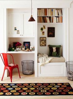 a room that has some bookshelves in it