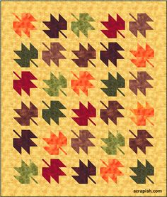 an image of a quilt with many different colors and shapes on the front, including arrows