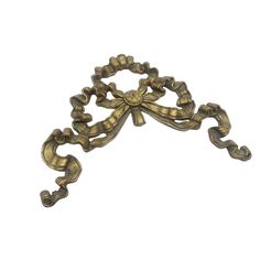 an antique brass door handle on a white background