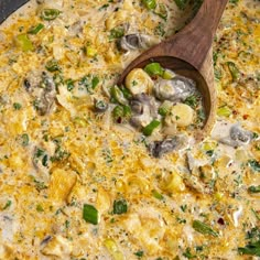 an omelet with mushrooms and green peppers in a skillet