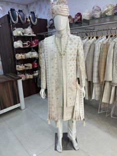 a mannequin dressed in an elaborately designed outfit