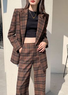 Indulge in luxury with our Nadia Coffee Plaid Blazer Wide Leg Pantsuit. This double-breasted set features a sophisticated and exclusive coffee plaid blazer and wide leg pants. Elevate your style and make a statement with this elegant and tasteful ensemble. Perfect for the fashion-forward and confident woman. Notched lapels Long sleeve Double-breasted button closure Wide leg pants Polyester,Spandex Item #241172 Women's blazer & wide-leg pants set SIZE INFO XS=US2=UK6=EU32 S=US4-6=UK8-10=EU34-36 M Brown Workwear Sets With Suit Collar, Brown Fall Office Suit, Fall Season Brown Office Suit, Brown Fall Pantsuit For Office, Brown Workwear Sets For Fall, Chic Brown Pantsuit For Work, Brown Sets For Workwear In Fall, Fall Double-breasted Sets For Office, Brown Double-breasted Fall Suit