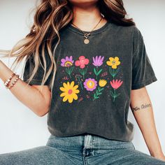 Comfort Colors® Water Color Wild Flower Shirt, Flower T Shirt, Vintage Floral Shirt, Wild Flower Shirt, Botanical Shirt, Gift for Grandma Introducing Our Signature Comfort Colors Shirt!  Indulge in ultimate comfort with our classic unisex jersey short sleeve and long sleeve tees! Crafted with 100% ring spun cotton and 30 singles, these shirts offer a luxurious feel with every wear. 💫  Key Features: Relaxed fit for that perfect, laid-back vibe. Topstitched, classic width rib collar for added durability. Shoulder-to-shoulder twill tape ensures a snug fit over time. Signature twill label adds a touch of sophistication.  Vibrant Colors: Our shirts are garment dyed to perfection, offering that lived-in feel with minimal shrinkage. Please note, slight shade variations are part of the unique pig Luxury Garment-dyed Short Sleeve T-shirt, Camp Half Blood Shirt, Time Signature, Blood Shirt, Flower T Shirt, Vintage Floral Shirt, Sibling Shirts, Botanical Shirt, Sister Shirts