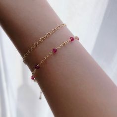 "* DETAILS* This dainty bracelet is a perfect gift to the one you love or to yourself. A nice every day bracelet. - AAA+ Natural Ruby Beads - 24k Gold Filled Chain - 14K GOLD FILLED Wire - 14k Gold Filled Spring Ring Clasp - 14k Gold Filled Link Rings - Bracelet has a 1\" Extension with gold filled ball charm. ✨All components are gold filled. 👉🏻For more birthstone bracelets, see https://www.etsy.com/shop/JinnysJewelryBySeJin You may also like 🌟Sapphire Bracelet. https://www.etsy.com/JinnysJew Affordable Dainty Bracelets For Birthday Gift, Affordable Dainty Jewelry For Birthday Gift, Affordable Cute Bracelets For Birthday, Red Ruby Bracelet, Stackable Necklaces, Balance Bracelet, Minimal Bracelet, Carnelian Bracelet, Ruby Bracelet