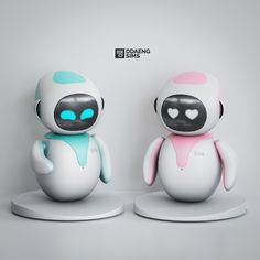 two white and blue robot figurines sitting next to each other