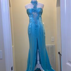 Custom Designed Sheri Hill Evening Gown Pageant Gown Size 2-4. Light Turquoise Color. Worn Twice. Beaded Lace, See Through In Some Places, Up To Halter With Single Lace Detail Down To Closure In Back. Low Cut/Open Back Under That. Center Split With Train On Skirt. Silk Is Lightweight So It Flows When You Walk. Bottom Underlayer Shows Dirt, And There Are A Couple Of Tiny Snags In Fabric Around Waist And Skirt. Sheri Hill, Lace Silk, Pageant Gowns, Light Turquoise, Silk Skirt, Turquoise Color, Custom Dresses, Beaded Lace, Low Cut